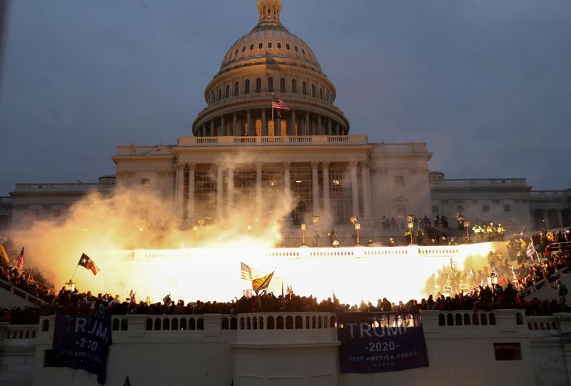 Biden’s Justice Dept may defend Trump in Capitol riot lawsuits