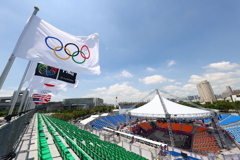 Olympics-Japan win softball opener as Games 'of hope' begin